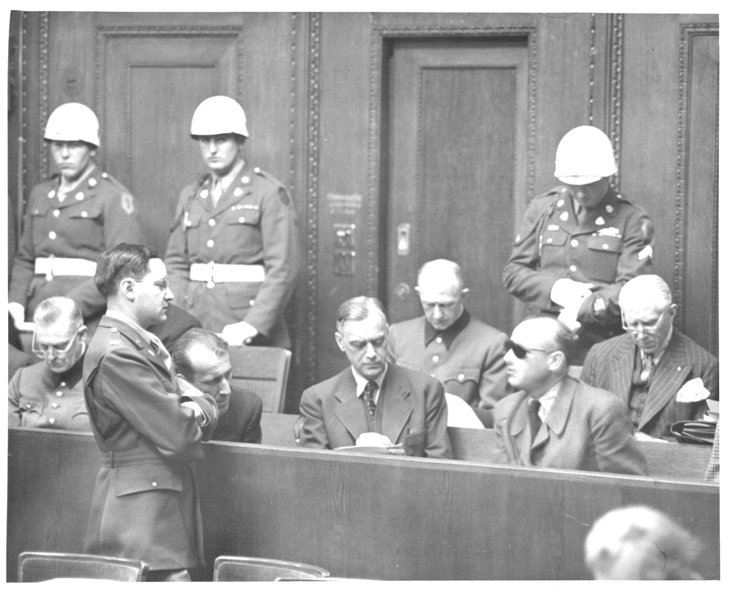 Captain Gustav Gilbert Listens to Defendant Hans Frank, IMT, Nuremberg Germany, 1945-1946